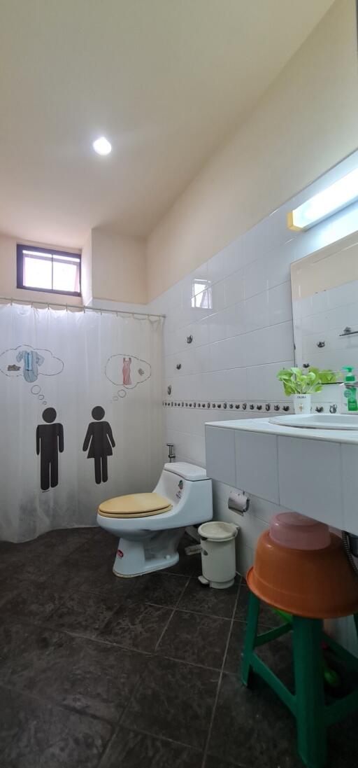 Bathroom with shower curtain and modern fixtures