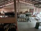 Spacious warehouse storage area with organized shelves and materials