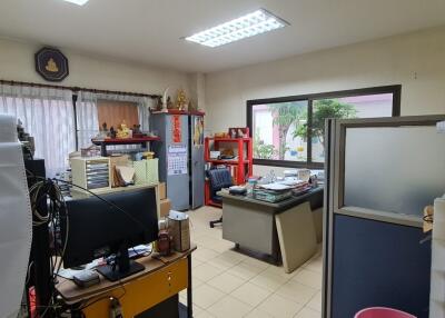 Spacious home office with various furnishings and equipment