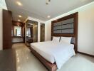 Master bedroom with modern furnishings and ensuite bathroom