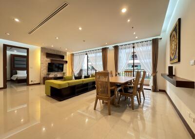 Spacious and well-lit living room with dining area