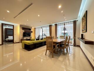 Spacious and well-lit living room with dining area