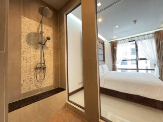 Bedroom with adjacent shower area