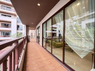 Spacious balcony with view into a modern apartment