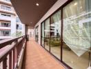 Spacious balcony with view into a modern apartment