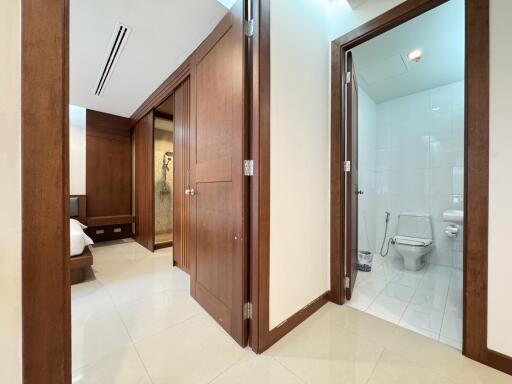 Spacious interior hallway leading to bedroom and bathroom