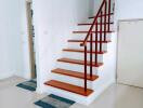 Staircase with wooden steps and metal railing