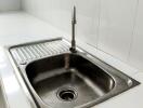 Modern kitchen sink with tile backsplash