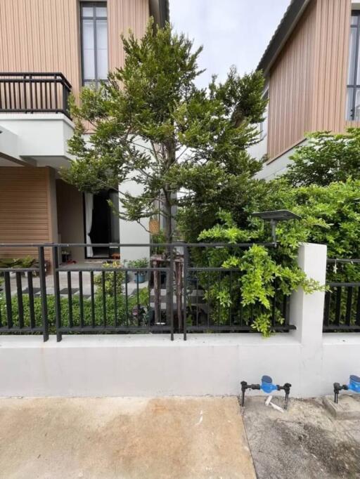 Front exterior view of a house with garden