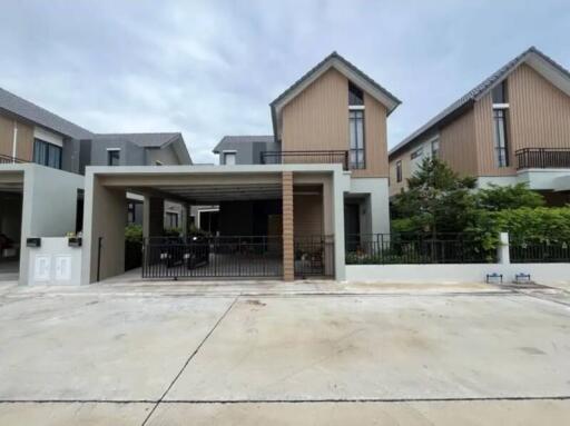 Modern residential building with a garage and patio area