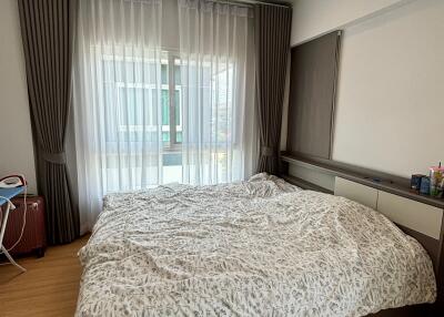 Bedroom with large bed and window