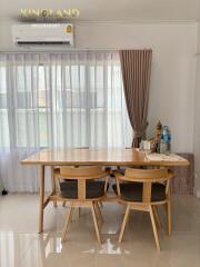 Modern dining area with wooden table and chairs