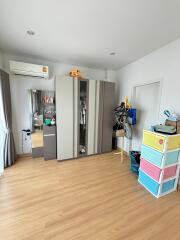 Bedroom with wooden floor and wardrobe