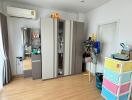 Bedroom with wooden floor and wardrobe