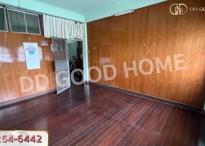 Empty room with wooden floor and walls