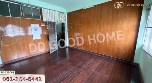 Empty room with wooden floor and walls