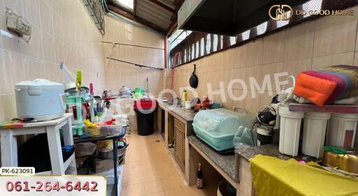 Spacious kitchen with various appliances and countertops