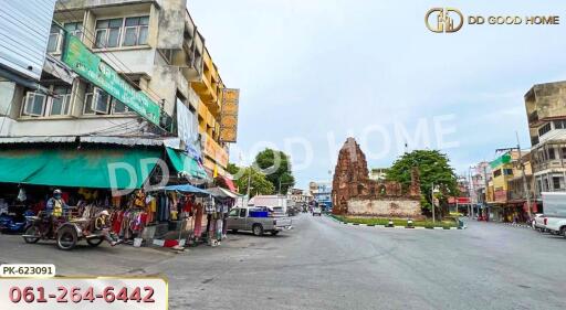 Street view with buildings and a historic monument