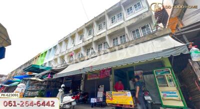 Exterior view of a commercial building with multiple floors and storefronts