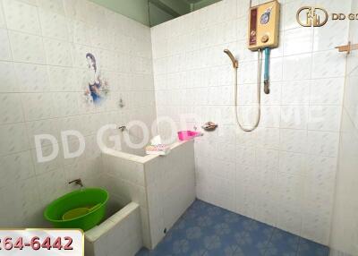 Bathroom with shower and green basin