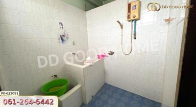 Bathroom with shower and green basin