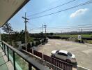 Balcony with view of street and surroundings