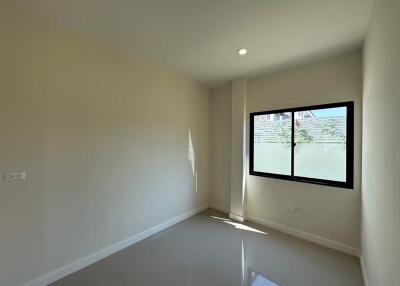 Bright and empty bedroom with window