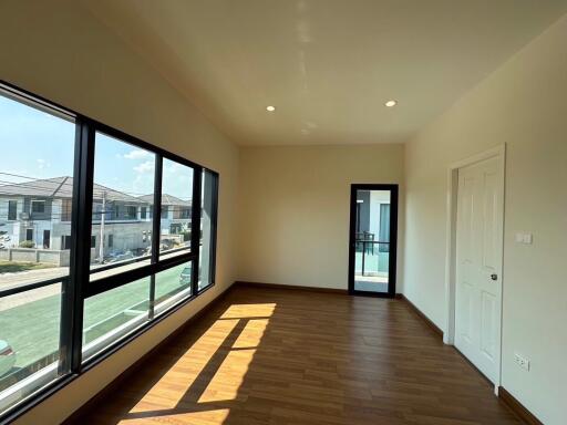 Spacious living room with large windows