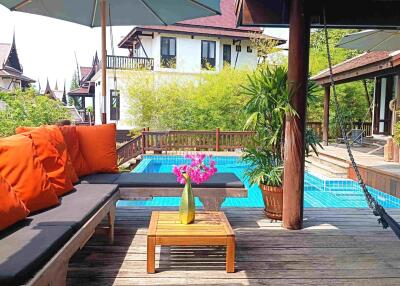 Outdoor patio with pool area and seating