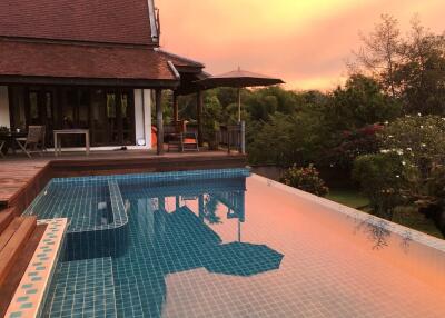 Building with pool at sunset