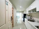 Modern hallway with view into the kitchen and living area