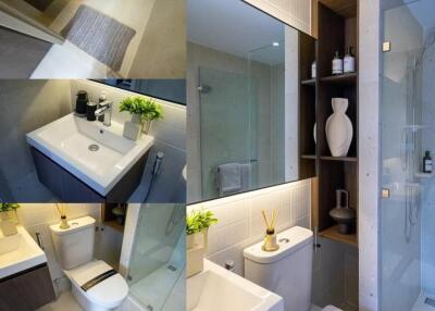 Modern bathroom with various amenities including a sink, toilet, shower, and shelving