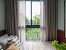 Cozy bedroom with large window and plants