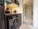 Modern laundry area next to a bathroom