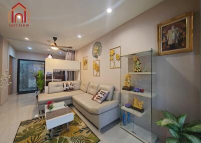 Spacious and modern living room with sectional sofa and decorative artworks