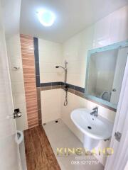 modern bathroom with sink, shower, and mirror