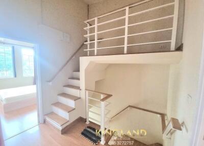 staircase leading to upper floor with modern railing