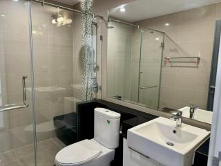 Modern bathroom with glass shower enclosure and contemporary fixtures