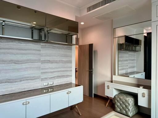 Modern bedroom with makeup vanity and storage cabinets