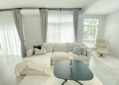 Modern living room with a beige sofa and coffee table