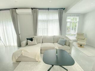 Modern living room with a beige sofa and coffee table