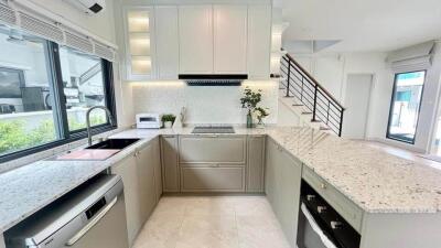 Modern kitchen with granite countertops and stainless steel appliances