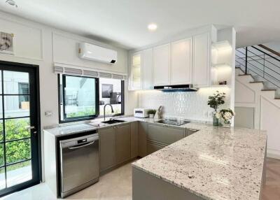 Modern kitchen with granite countertops and stainless steel appliances