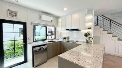 Modern kitchen with granite countertops and stainless steel appliances