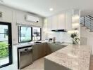 Modern kitchen with granite countertops and stainless steel appliances