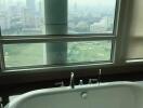 Bathroom with Tub and City View