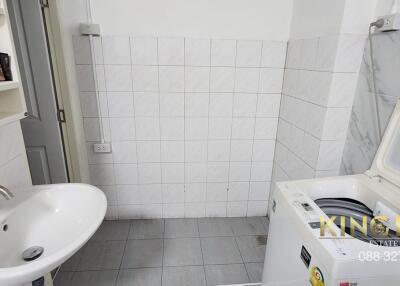 Laundry room with sink and washing machine