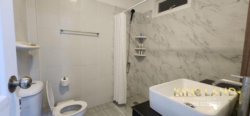 Modern bathroom with shower and toilet