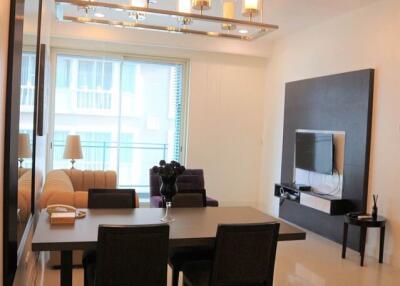 Modern living room with dining area and large window