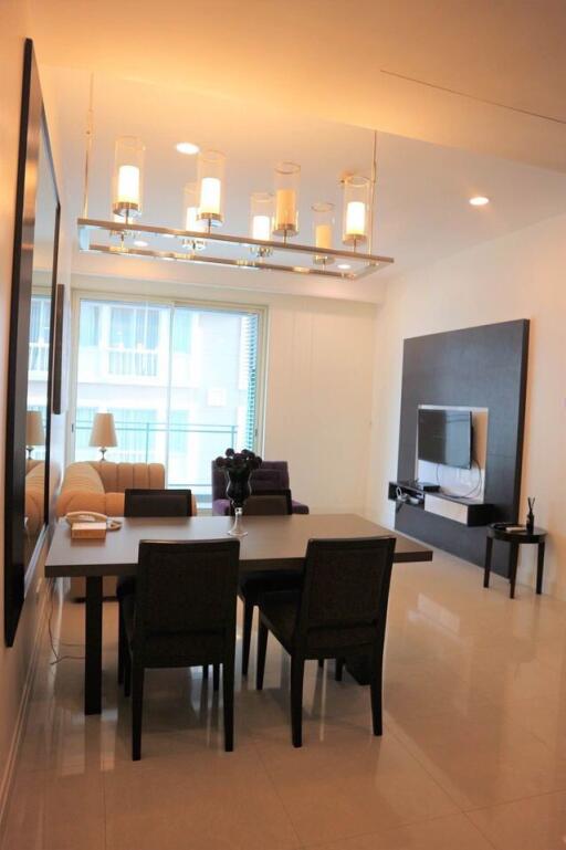 Modern living room with dining area and large window